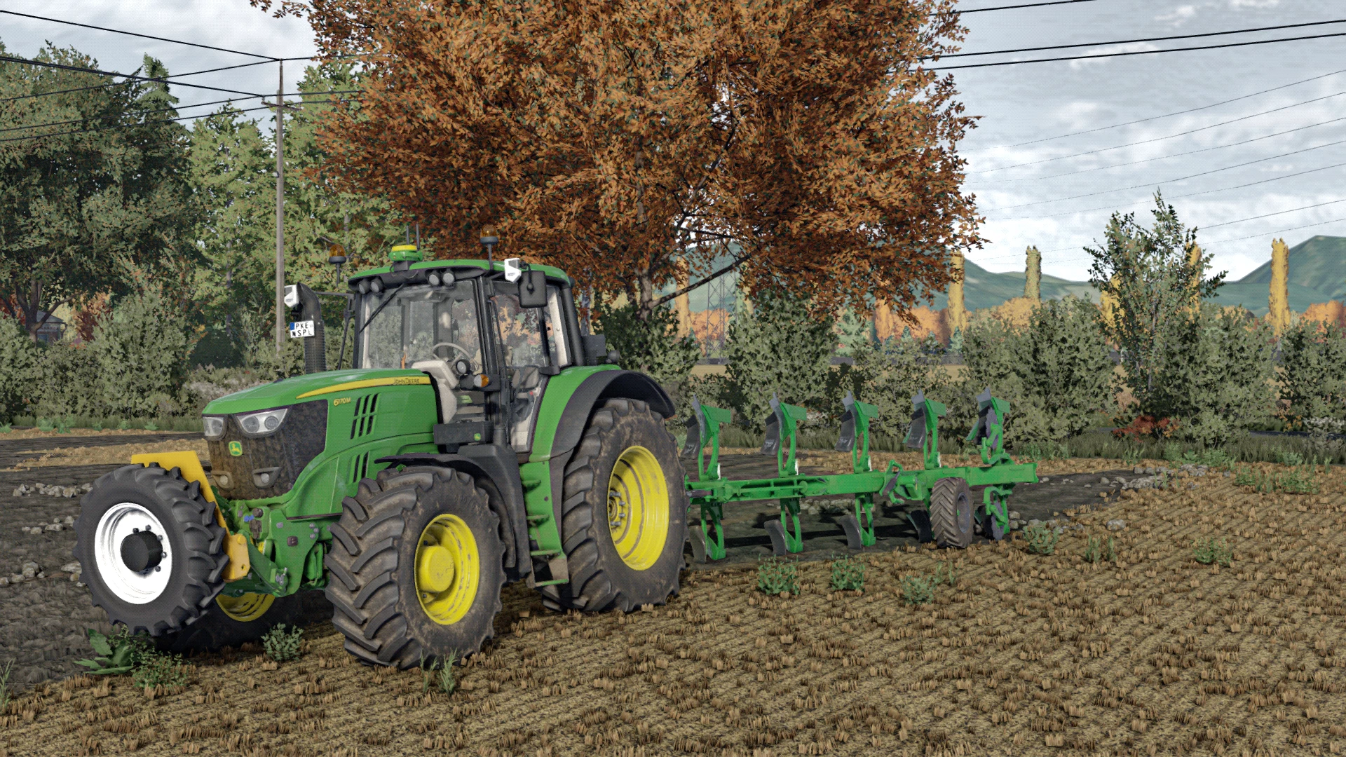 Modern Tractor Plowing Field on a Crisp Autumn Day